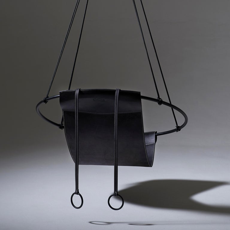 https://a.1stdibscdn.com/sling-hanging-swing-chair-genuine-black-leather-21st-century-modern-for-sale-picture-5/f_32773/f_95536231610228566637/6_Sling_Black_with_Bolster_BACK_mood_master.jpg?width=768