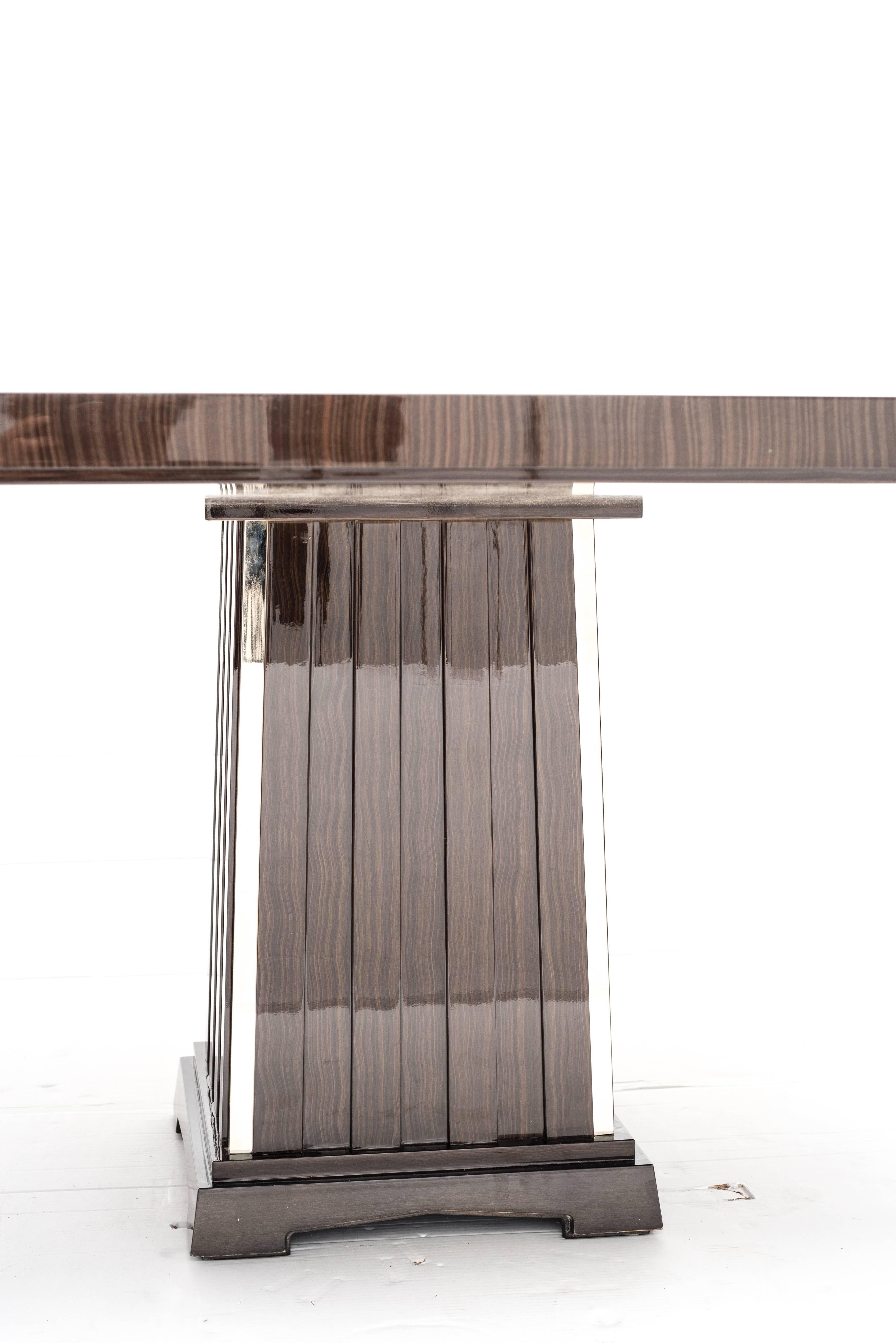 https://a.1stdibscdn.com/art-deco-style-important-dining-room-table-veneer-wood-top-and-chrome-inserts-for-sale-picture-3/f_9859/f_207354321601055001305/6_master.jpg