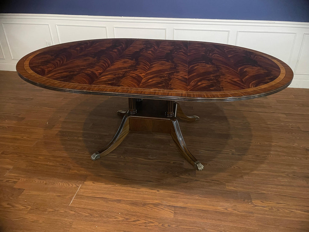 https://a.1stdibscdn.com/round-oval-mahogany-georgian-style-single-pedestal-dining-table-by-leighton-hall-for-sale-picture-3/f_44162/f_135448321680917257481/7B47081D_61F8_4B72_B11B_90751C4354BF_master.jpeg
