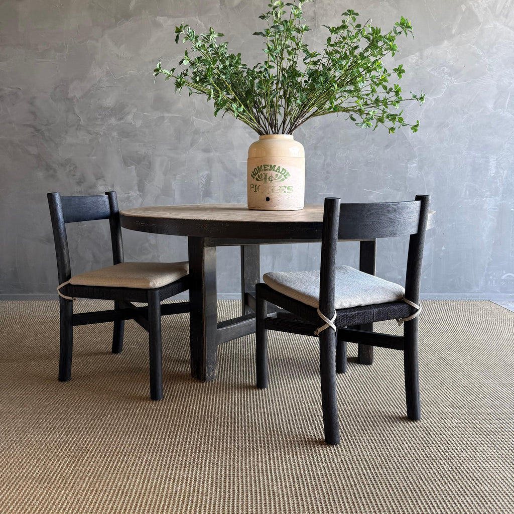 https://a.1stdibscdn.com/reclaimed-pine-wood-60-round-dining-table-with-black-painted-finish-for-sale-picture-2/f_18223/f_459068621752701217112/7L_15_1_master.jpg