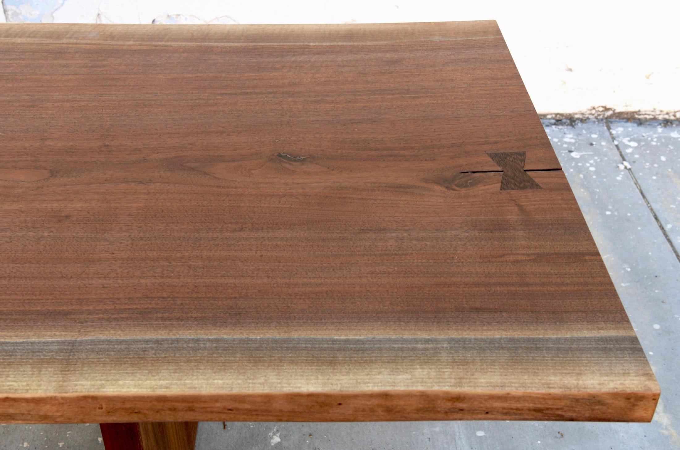 https://a.1stdibscdn.com/walnut-slab-live-edge-dining-table-custom-made-by-petersen-antiques-for-sale-picture-10/f_8065/1597847490735/8D466D75_388E_47D4_ABA6_F9E37DD7EE59_master.jpeg