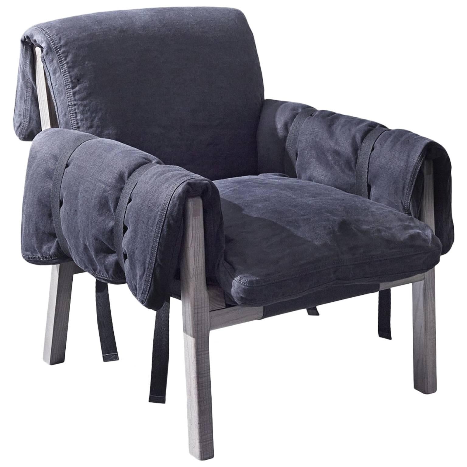 https://a.1stdibscdn.com/strapped-armchair-with-fiber-and-varnished-ash-frame-by-moroso-for-diesel-for-sale/1121189/f_99792531520254528166/9979253_master.jpg
