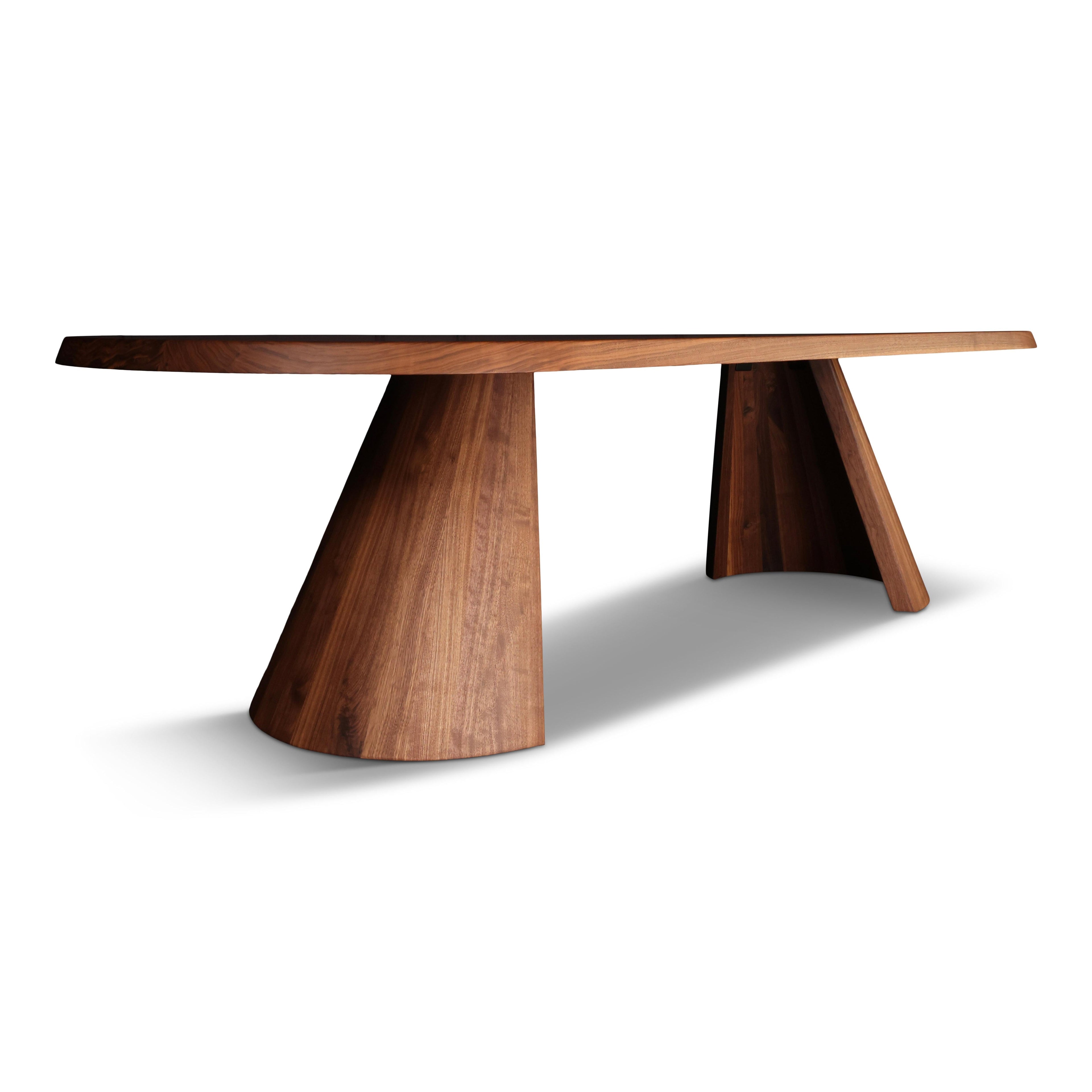 https://a.1stdibscdn.com/solid-walnut-dining-table-turned-cove-base-in-stock-for-sale-picture-4/f_51472/f_248493021628610393523/A009D610_0CFA_46AA_A16B_72EC14FE69ED_master.jpg