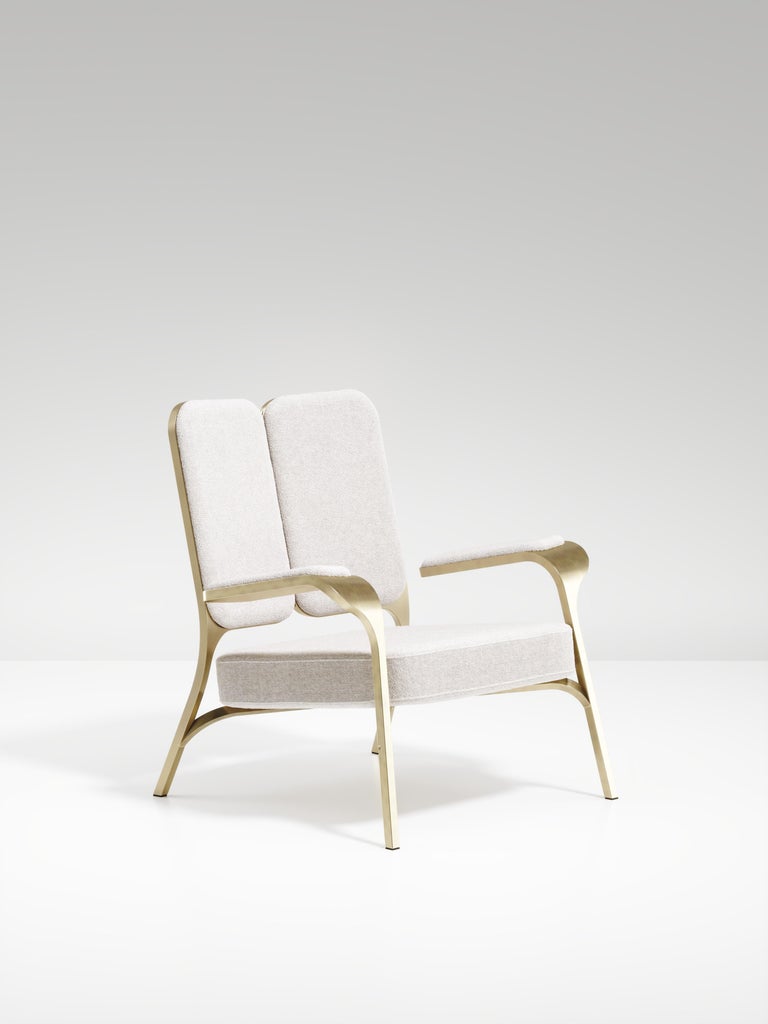 https://a.1stdibscdn.com/upholstered-armchair-with-bronze-patina-brass-details-by-ry-augousti-for-sale-picture-2/f_45491/f_320557621672963404959/ACH08_PFC_1_master.jpg?width=768