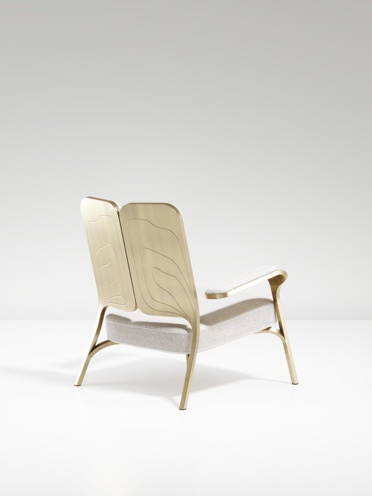 https://a.1stdibscdn.com/upholstered-armchair-with-bronze-patina-brass-details-by-ry-augousti-for-sale-picture-3/f_45491/f_320557621672879475614/ACH08_PFC_2_master.jpg?width=768