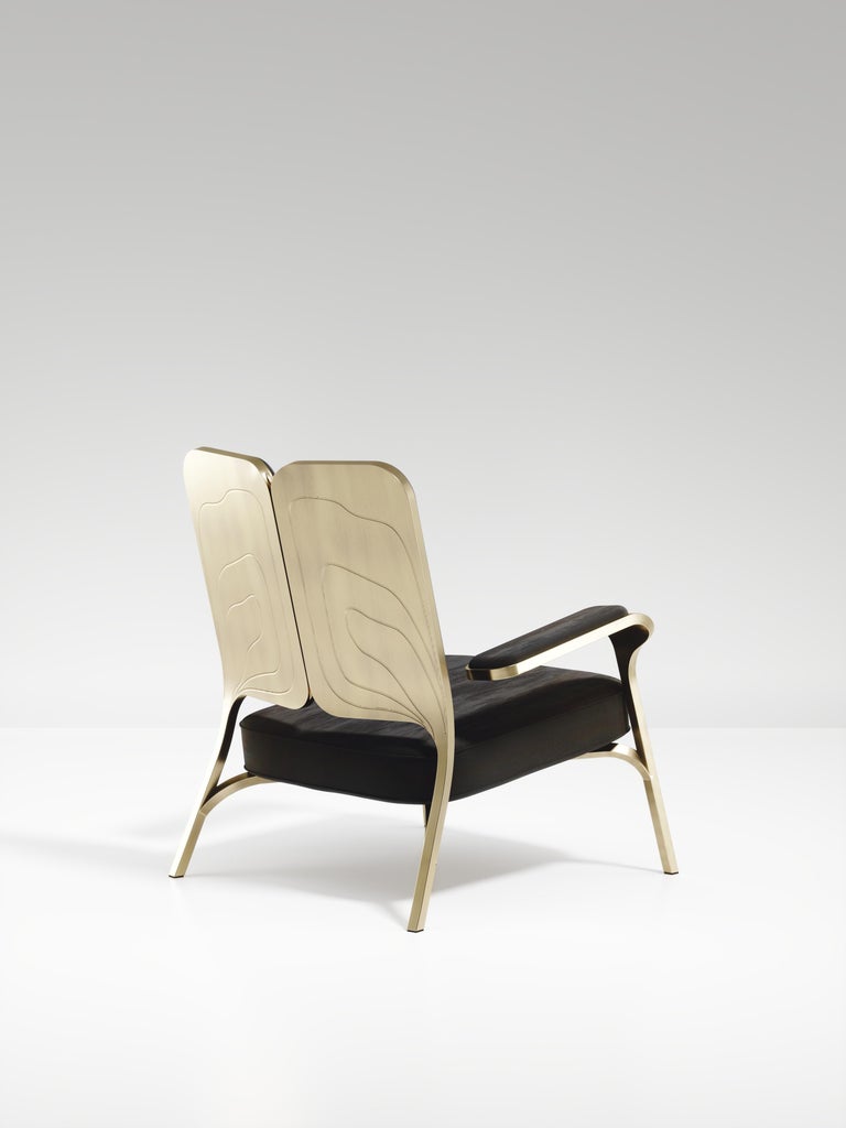 https://a.1stdibscdn.com/upholstered-armchair-with-bronze-patina-brass-details-by-ry-augousti-for-sale-picture-2/f_45491/f_320557121672878904754/ACH08_VL1_2_master.jpg?width=768