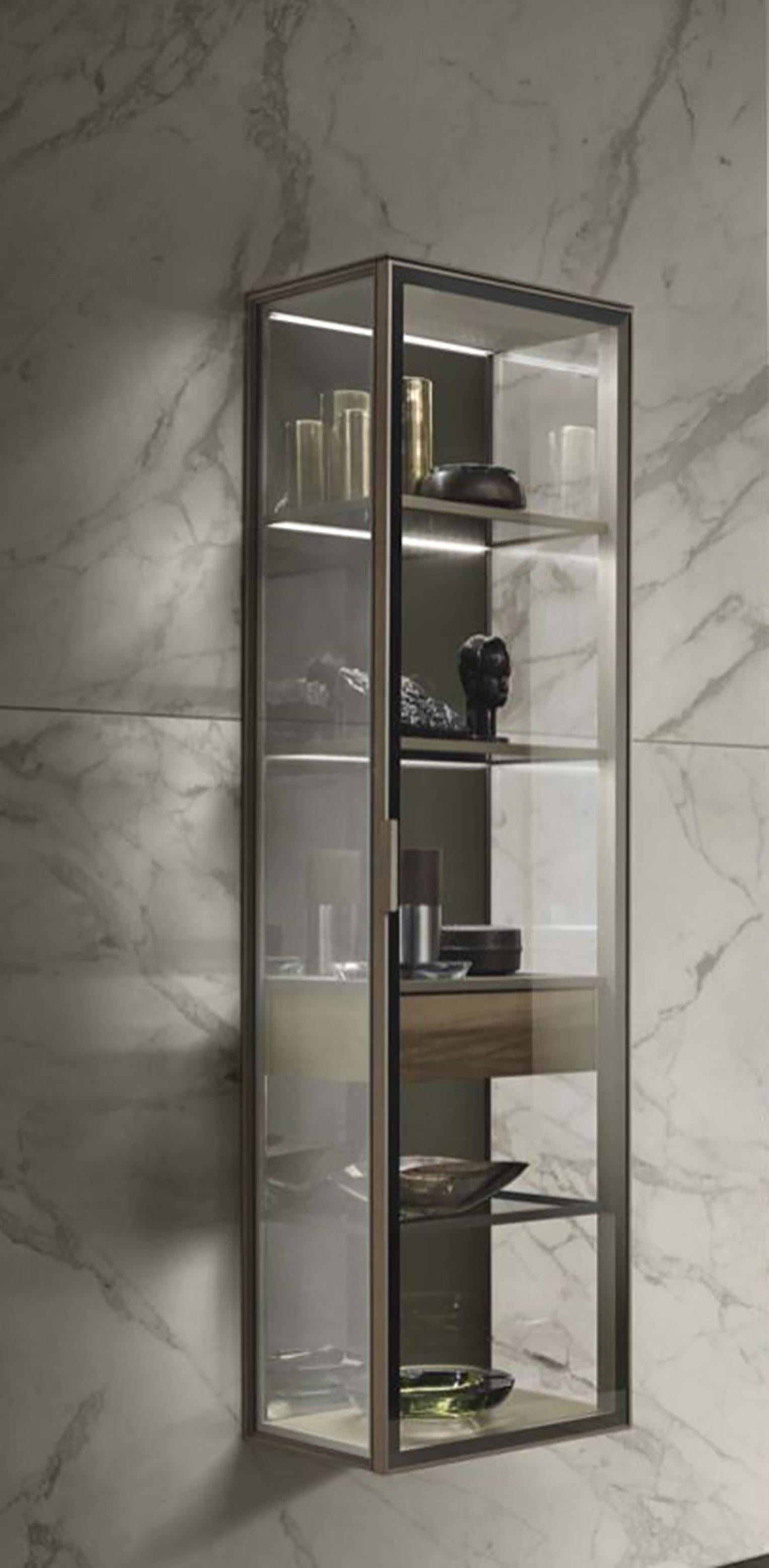 https://a.1stdibscdn.com/glass-and-walnut-wood-vertical-wall-cabinet-for-sale-picture-3/f_27783/f_193394611591626491021/ALAMBRA_WALL_UNIT_VERTICAL_1_Design_Giuseppe_Bavuso_master.jpg