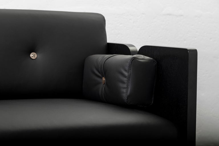 https://a.1stdibscdn.com/perfidia-3-seater-sofa-in-ebano-wood-leather-aged-brass-by-estudio-andean-for-sale-picture-6/f_12192/f_468714421759251695643/ANDEAN_APERASU02K_13_CHRISFALCONY_1__master.jpg?width=768