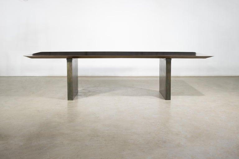 https://a.1stdibscdn.com/sculptural-twin-pedestal-patinated-steel-dining-table-andre-fierro-x-costantini-for-sale-picture-3/f_25173/f_482514521767973117108/Andre_Fierro_Table_Gun_Metal_Patinated_Steel_Twin_Pedestal_Dining_Table_by_Costantini_01_master.jpg?width=768