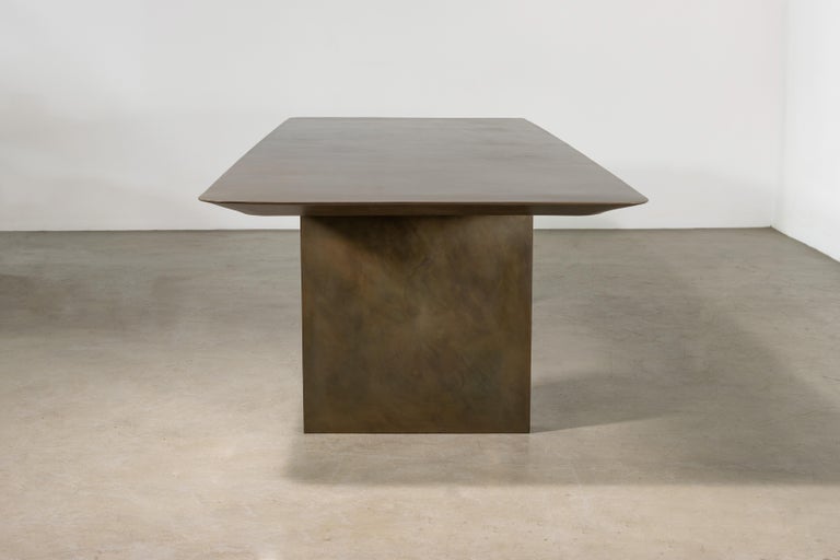 https://a.1stdibscdn.com/sculptural-twin-pedestal-patinated-steel-dining-table-andre-fierro-x-costantini-for-sale-picture-4/f_25173/f_482514521767973117683/Andre_Fierro_Table_Gun_Metal_Patinated_Steel_Twin_Pedestal_Dining_Table_by_Costantini_02_master.jpg?width=768