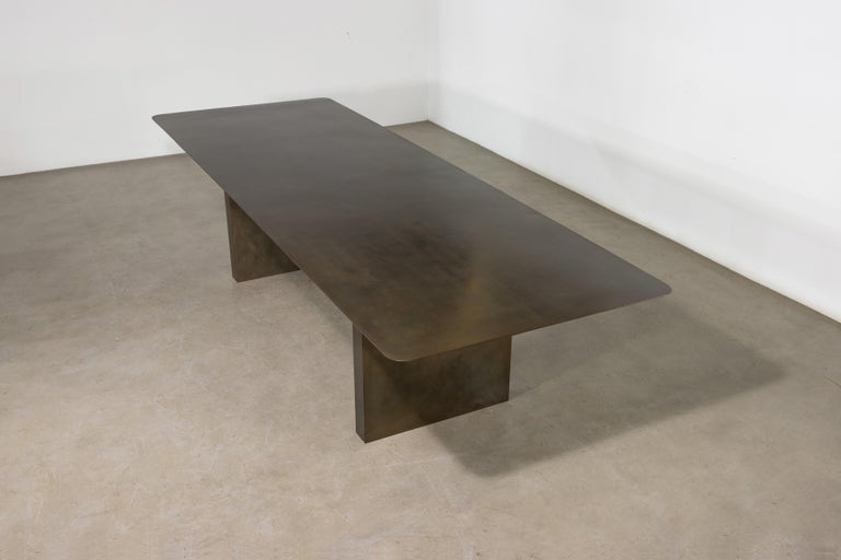 https://a.1stdibscdn.com/sculptural-twin-pedestal-patinated-steel-dining-table-andre-fierro-x-costantini-for-sale-picture-5/f_25173/f_482514521767973117913/Andre_Fierro_Table_Gun_Metal_Patinated_Steel_Twin_Pedestal_Dining_Table_by_Costantini_03_master.jpg?width=768