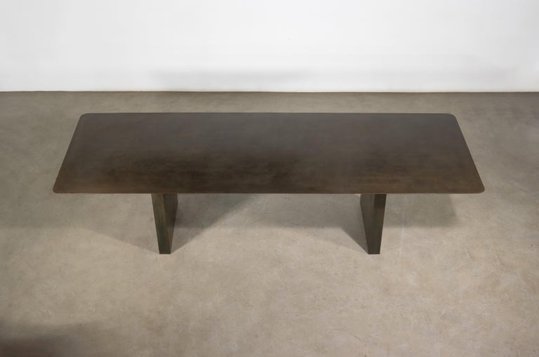 https://a.1stdibscdn.com/sculptural-twin-pedestal-patinated-steel-dining-table-andre-fierro-x-costantini-for-sale-picture-6/f_25173/f_482514521767973117022/Andre_Fierro_Table_Gun_Metal_Patinated_Steel_Twin_Pedestal_Dining_Table_by_Costantini_04_master.jpg?width=768