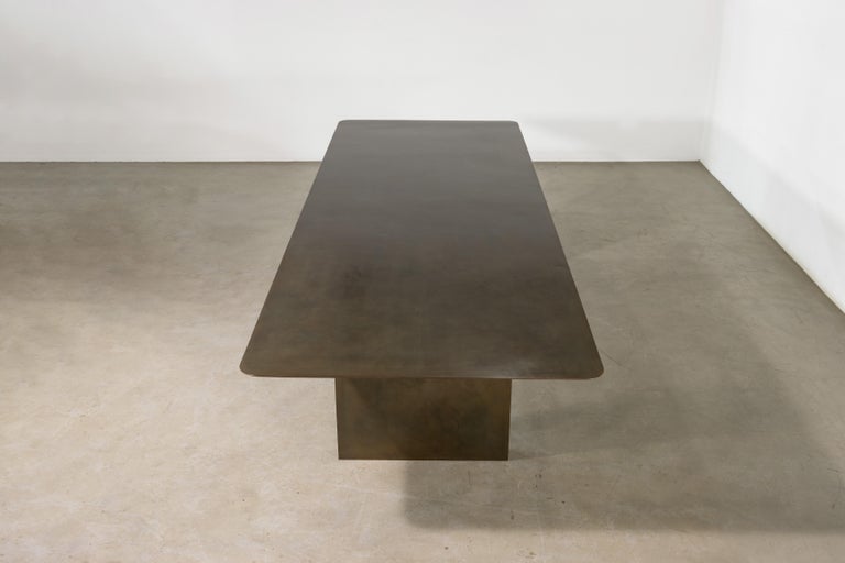 https://a.1stdibscdn.com/sculptural-twin-pedestal-patinated-steel-dining-table-andre-fierro-x-costantini-for-sale-picture-7/f_25173/f_482514521767973117859/Andre_Fierro_Table_Gun_Metal_Patinated_Steel_Twin_Pedestal_Dining_Table_by_Costantini_05_master.jpg?width=768