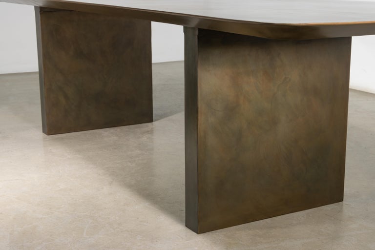 https://a.1stdibscdn.com/sculptural-twin-pedestal-patinated-steel-dining-table-andre-fierro-x-costantini-for-sale-picture-8/f_25173/f_482514521767973130710/Andre_Fierro_Table_Gun_Metal_Patinated_Steel_Twin_Pedestal_Dining_Table_by_Costantini_06_master.jpg?width=768