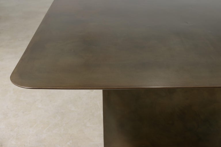 https://a.1stdibscdn.com/sculptural-twin-pedestal-patinated-steel-dining-table-andre-fierro-x-costantini-for-sale-picture-9/f_25173/f_482514521767973130686/Andre_Fierro_Table_Gun_Metal_Patinated_Steel_Twin_Pedestal_Dining_Table_by_Costantini_07_master.jpg?width=768