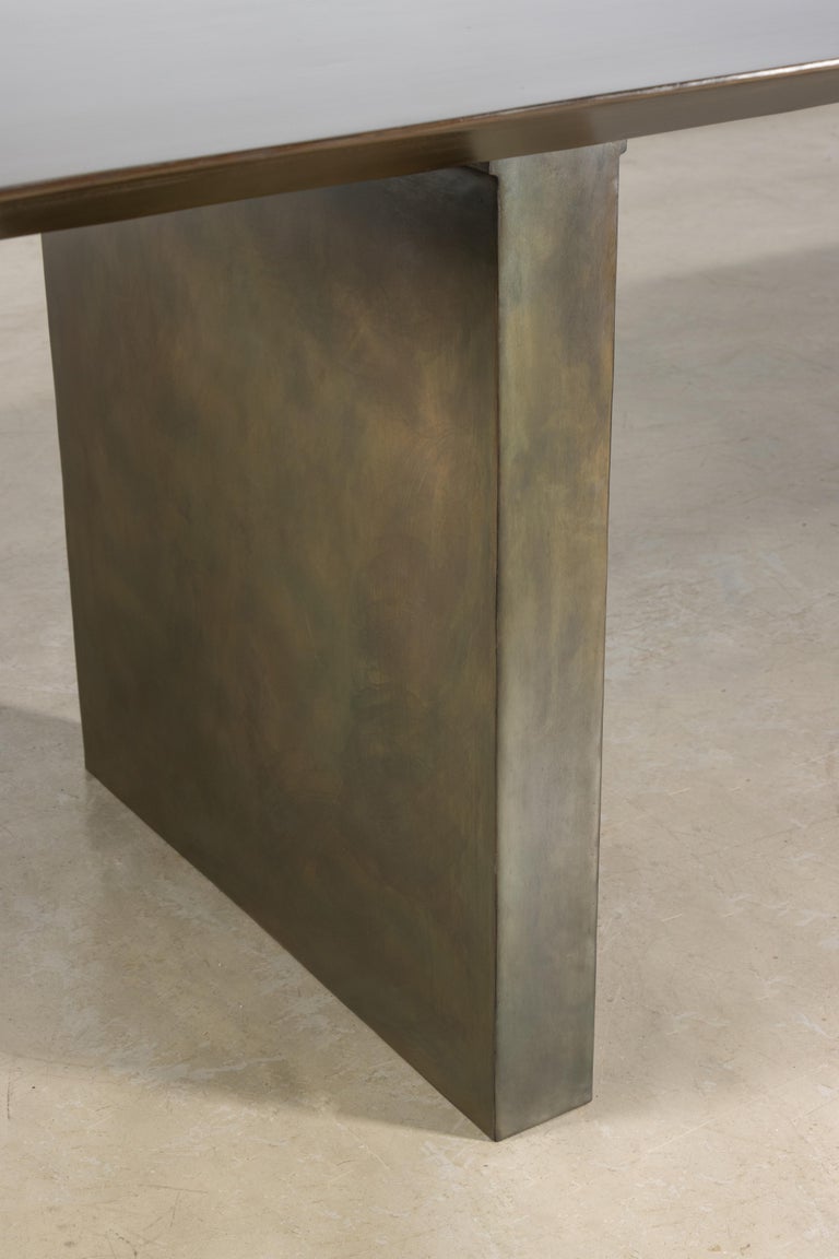 https://a.1stdibscdn.com/sculptural-twin-pedestal-patinated-steel-dining-table-andre-fierro-x-costantini-for-sale-picture-11/f_25173/f_482514521767973130428/Andre_Fierro_Table_Gun_Metal_Patinated_Steel_Twin_Pedestal_Dining_Table_by_Costantini_09_master.jpg?width=768