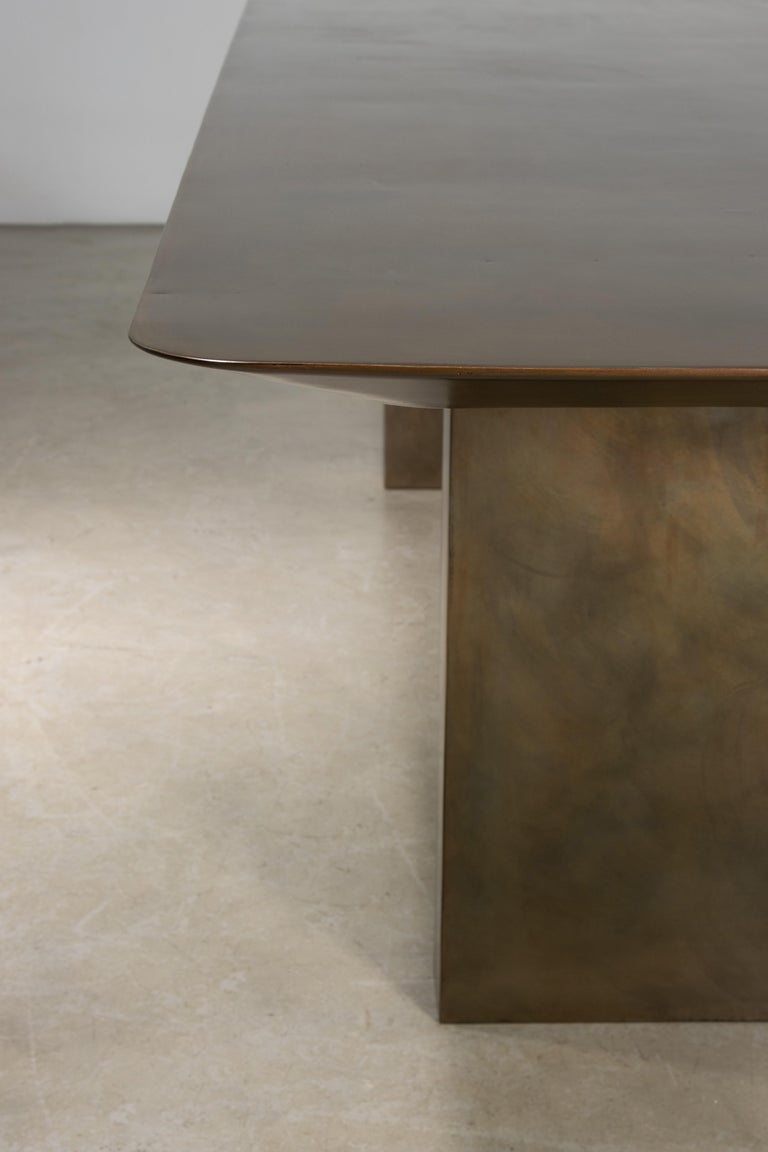 https://a.1stdibscdn.com/sculptural-twin-pedestal-patinated-steel-dining-table-andre-fierro-x-costantini-for-sale-picture-12/f_25173/f_482514521767973129267/Andre_Fierro_Table_Gun_Metal_Patinated_Steel_Twin_Pedestal_Dining_Table_by_Costantini_10_master.jpg?width=768