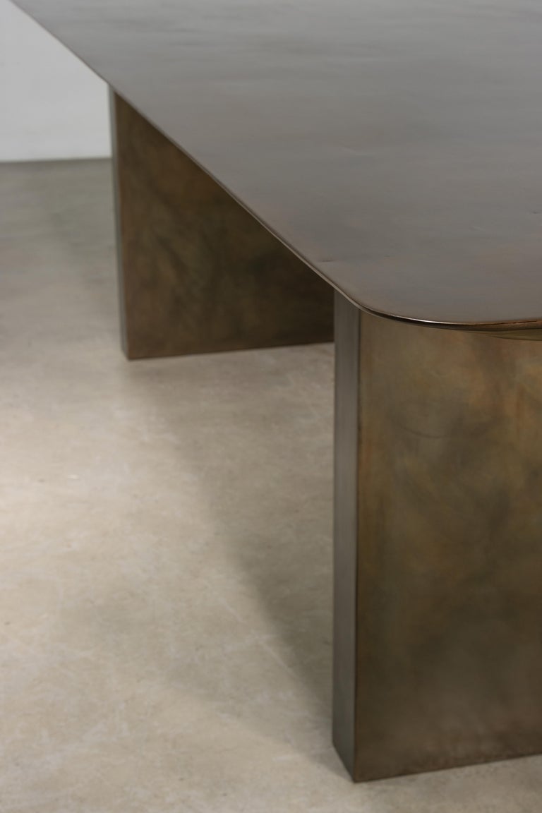 https://a.1stdibscdn.com/sculptural-twin-pedestal-patinated-steel-dining-table-andre-fierro-x-costantini-for-sale-picture-13/f_25173/f_482514521767973129533/Andre_Fierro_Table_Gun_Metal_Patinated_Steel_Twin_Pedestal_Dining_Table_by_Costantini_11_master.jpg?width=768