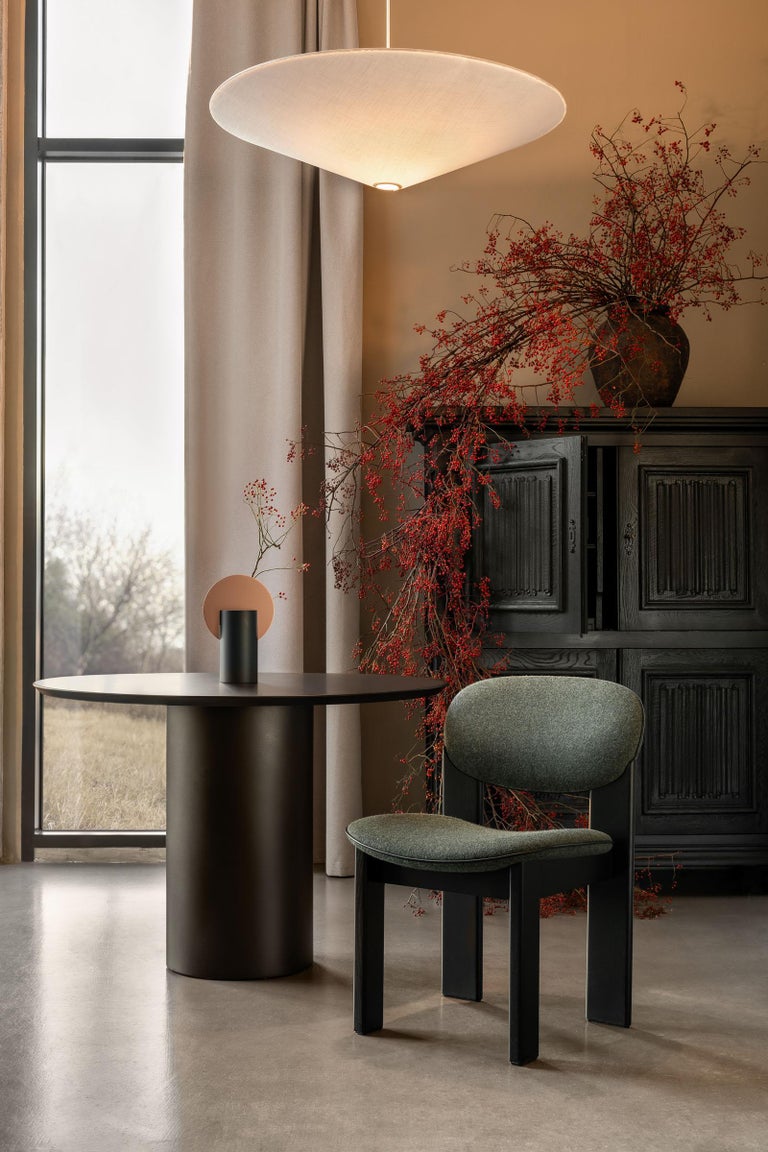 https://a.1stdibscdn.com/sculpted-dining-chair-in-forest-green-kvadrat-wool-archipen-by-noom-for-sale-picture-14/f_42321/f_420096021778160544689/Archipen_chair_by_NOOM_in_interior_10__master.jpg?width=768