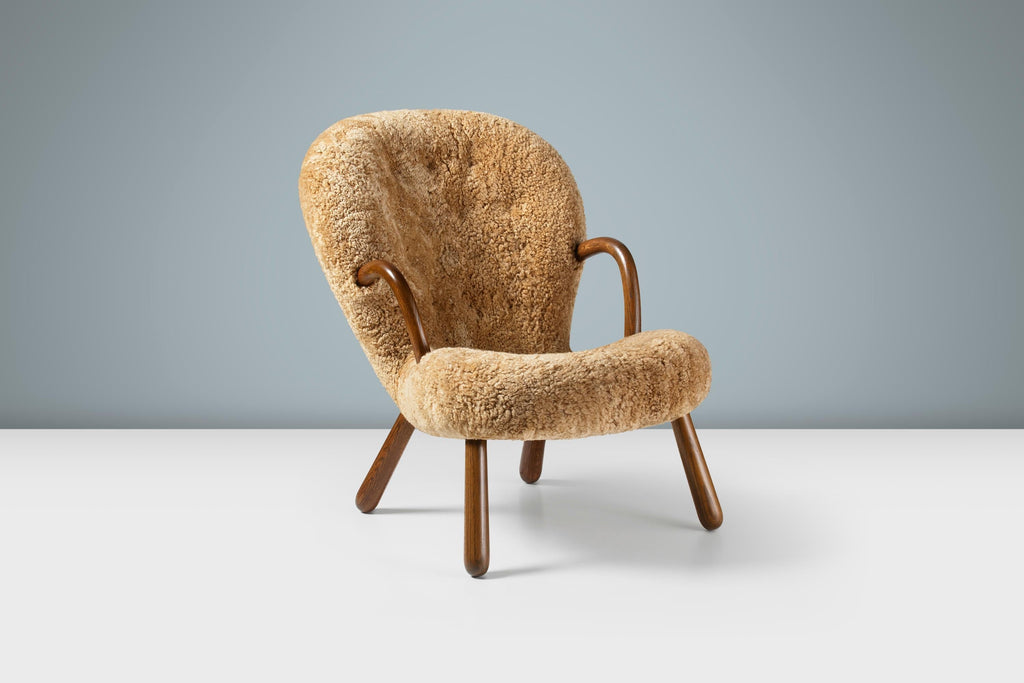 https://a.1stdibscdn.com/arnold-madsen-sheepskin-clam-chair-stool-for-sale-picture-4/f_13332/f_425325221732923745344/ArnoldMadsen_ClamChair_SK_Maple_Fumed_Oak_Angle_Stage_master.jpg