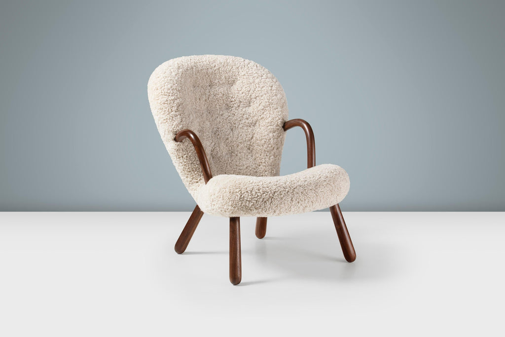https://a.1stdibscdn.com/arnold-madsen-sheepskin-clam-chair-stool-for-sale-picture-3/f_13332/f_413826121725795213745/ArnoldMadsen_Clam_Chair_SK_Moonlight_Walnut_Angle_Stage_master.jpg