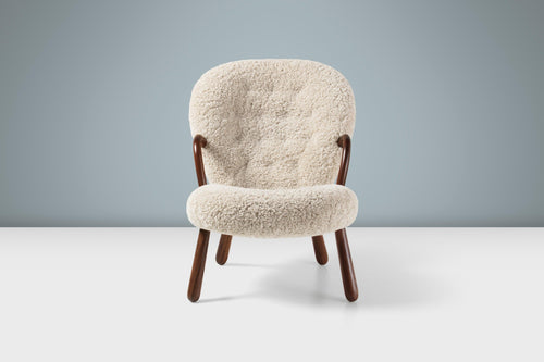 https://a.1stdibscdn.com/arnold-madsen-sheepskin-clam-chair-stool-for-sale-picture-2/f_13332/f_413826121725795213206/ArnoldMadsen_Clam_Chair_SK_Moonlight_Walnut_Front_Stage_master.jpg