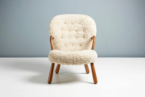 https://a.1stdibscdn.com/pair-of-arnold-madsen-sheepskin-clam-chairs-1944-for-sale-picture-2/f_67442/f_288877121653949141459/ArnoldMadsen_Dagmar_ClamChairREPRO_MoonlightOiledOak_03_copy_master.jpg?width=768