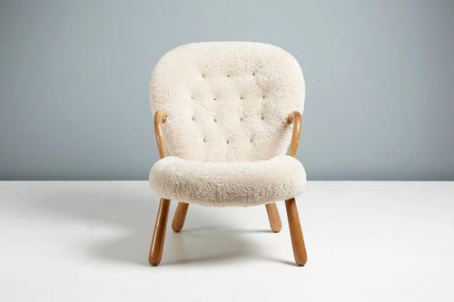 https://a.1stdibscdn.com/arnold-madsen-sheepskin-clam-chair-for-sale-picture-2/f_67442/f_290597221654875957903/ArnoldMadsen_Dagmar_ClamChairREPRO_MoonlightOiledOak_07_master.jpg?width=768