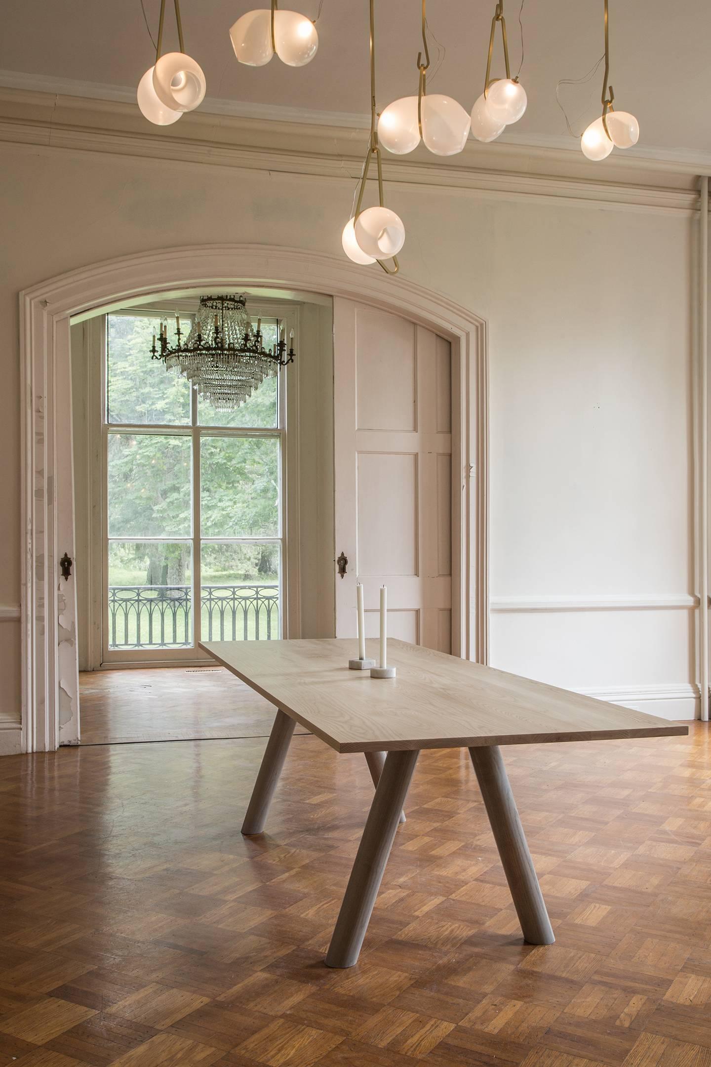 https://a.1stdibscdn.com/contemporary-wood-angled-leg-column-dining-table-in-white-oak-by-fort-standard-for-sale-picture-4/archivesE/upload/f_36481/f_105190131524518153677/Ash_column_dining_1_master.jpg