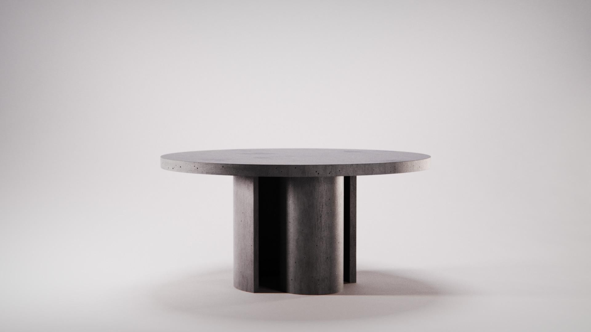https://a.1stdibscdn.com/concrete-circular-dining-table-atlante-ultra-high-perfomance-cement-mortar-for-sale-picture-6/f_38941/f_438743321741011479075/Atlante_Dining_Table_designed_by_Gabriele_De_Chirico_150x73_Ardesia__master.jpg