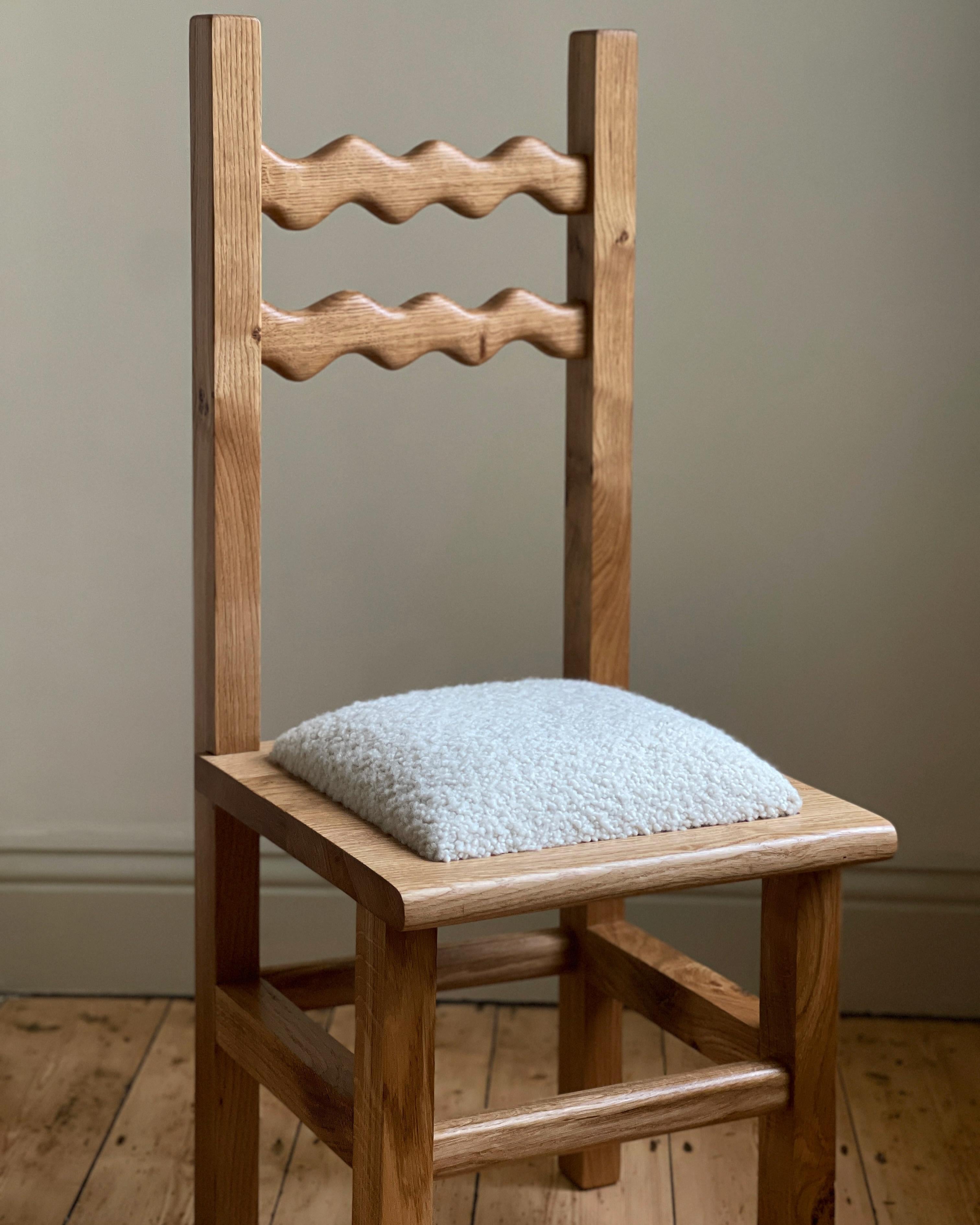 https://a.1stdibscdn.com/sunday-chair-oak-and-boucle-for-sale-picture-3/f_85912/f_339068921682013479733/B2DD6246_05D1_4D0A_8AFA_5826BBDEA57F_master.jpeg