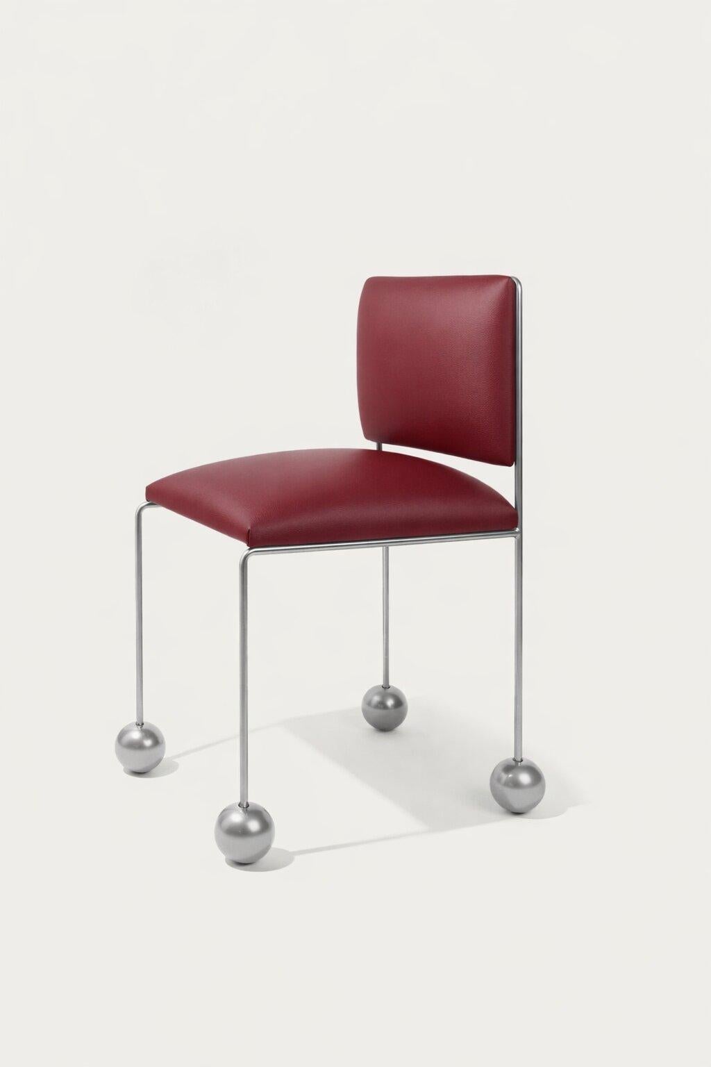 https://a.1stdibscdn.com/ball-foot-sculptural-chair-vegan-cactus-leather-burgundy-for-sale-picture-2/f_69682/f_487506221770746121890/Ball_Foot_Chair_Tuna_Red_master.jpg