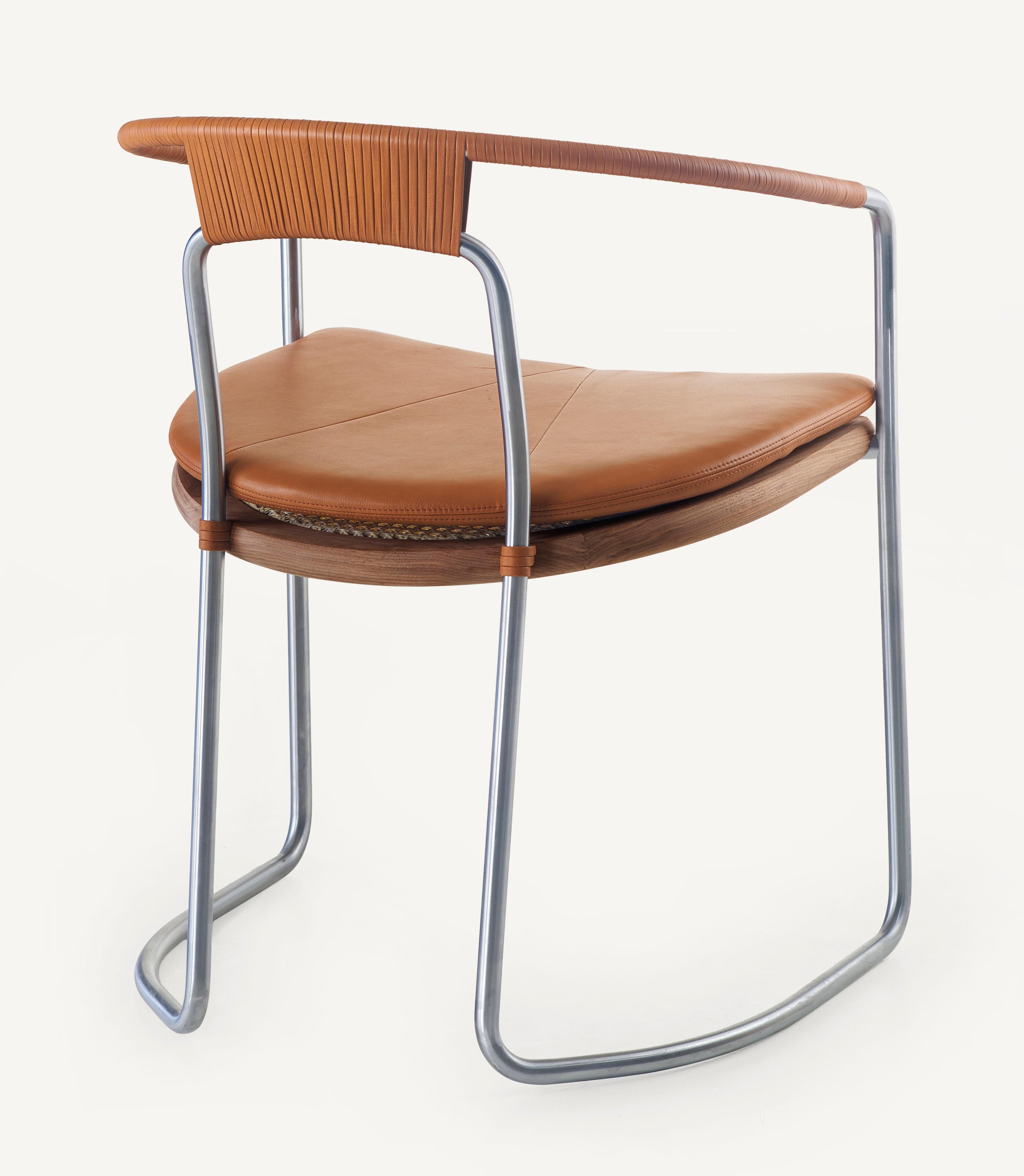 https://a.1stdibscdn.com/archivesE/upload/f_55842/1612413807325/BassamFellows_CB_450_Geometric_Side_Chair_in_Walnut_and_Satin_Nickel_3_4_back_credit_MARCO_FAVALI_master.jpg