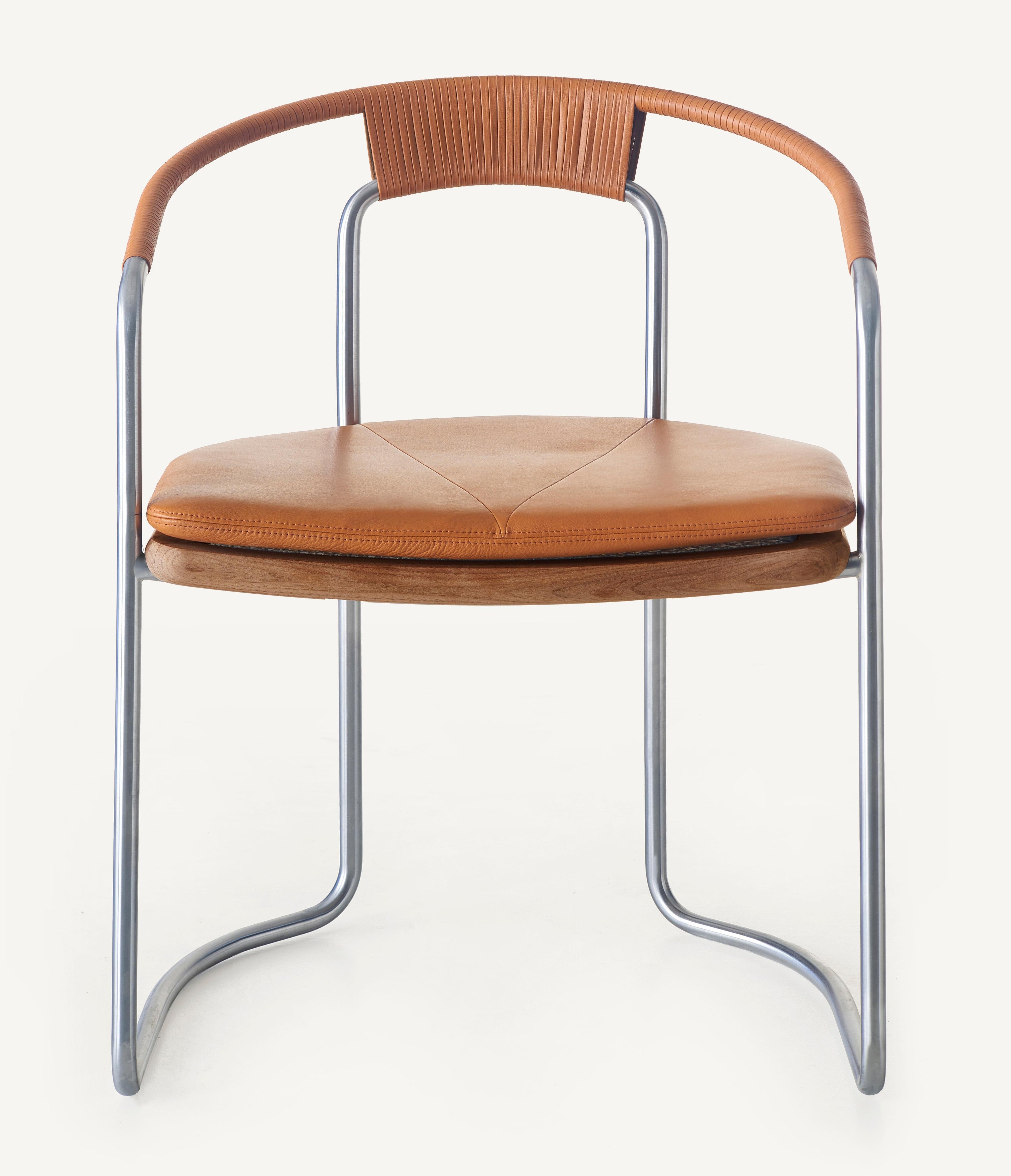 https://a.1stdibscdn.com/archivesE/upload/f_55842/1612413819406/BassamFellows_CB_450_Geometric_Side_Chair_in_Walnut_and_Satin_Nickel_front_credit_MARCO_FAVALI_master.jpg
