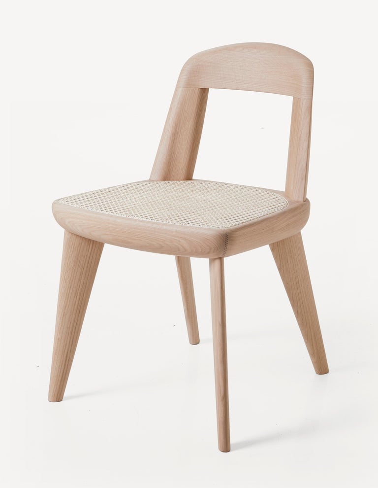 https://a.1stdibscdn.com/archivesE/upload/f_55842/1611957640190/BassamFellows_CB_47_Brutus_Armless_Chair_in_Oak_Raw_Effect_with_Vienna_Cane_seat_three_quarter_front_Photography_Marco_Faval_master.jpg?width=768