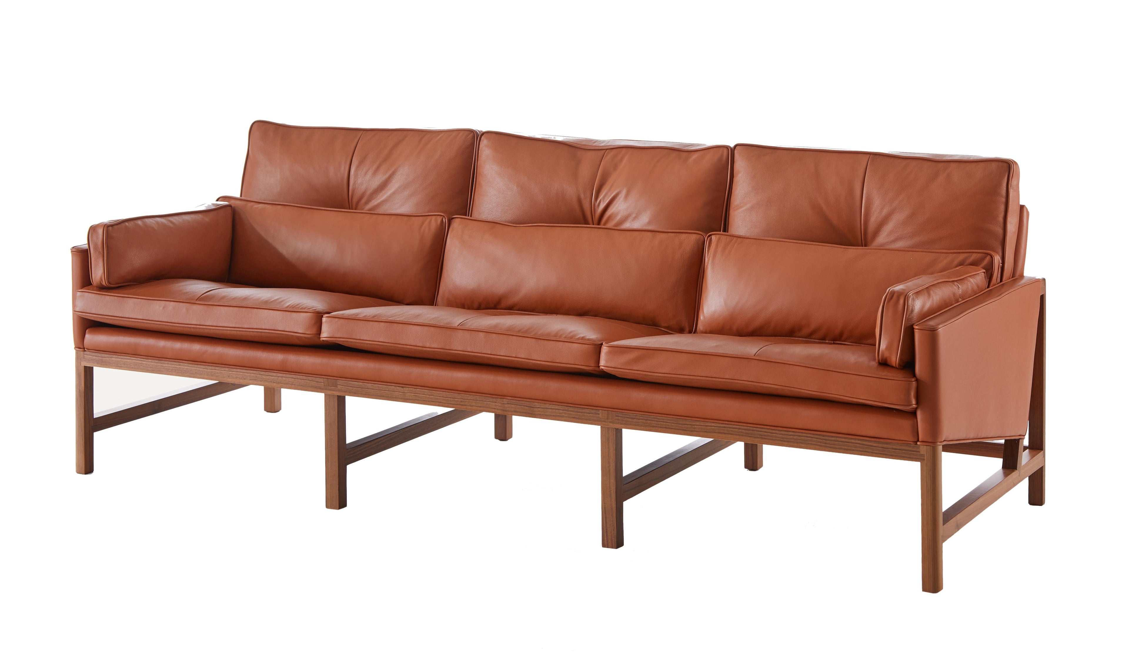 https://a.1stdibscdn.com/archivesE/upload/f_55842/1612821868004/BassamFellows_CB_53_Wood_Frame_Sofa_solid_Walnut_and_Grade_A_leather_British_Tan_three_quarter_front_photo_credit_MARCO_FAVALI_master.jpg
