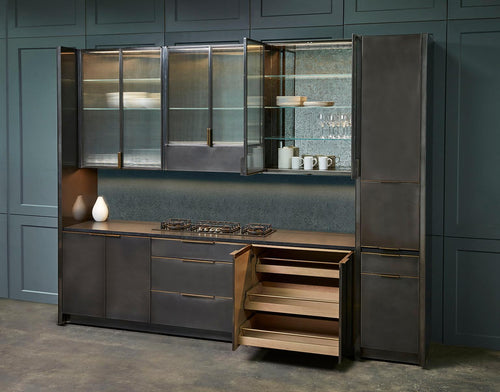 https://a.1stdibscdn.com/amuneals-gunmetal-kitchen-for-sale-picture-2/f_28333/f_128603321543589373593/Blackened_Steel_Kitchen_Full_Angled_Styled_multiple_doors_open_2_Ammuneal_6_22_1712422_master.jpg