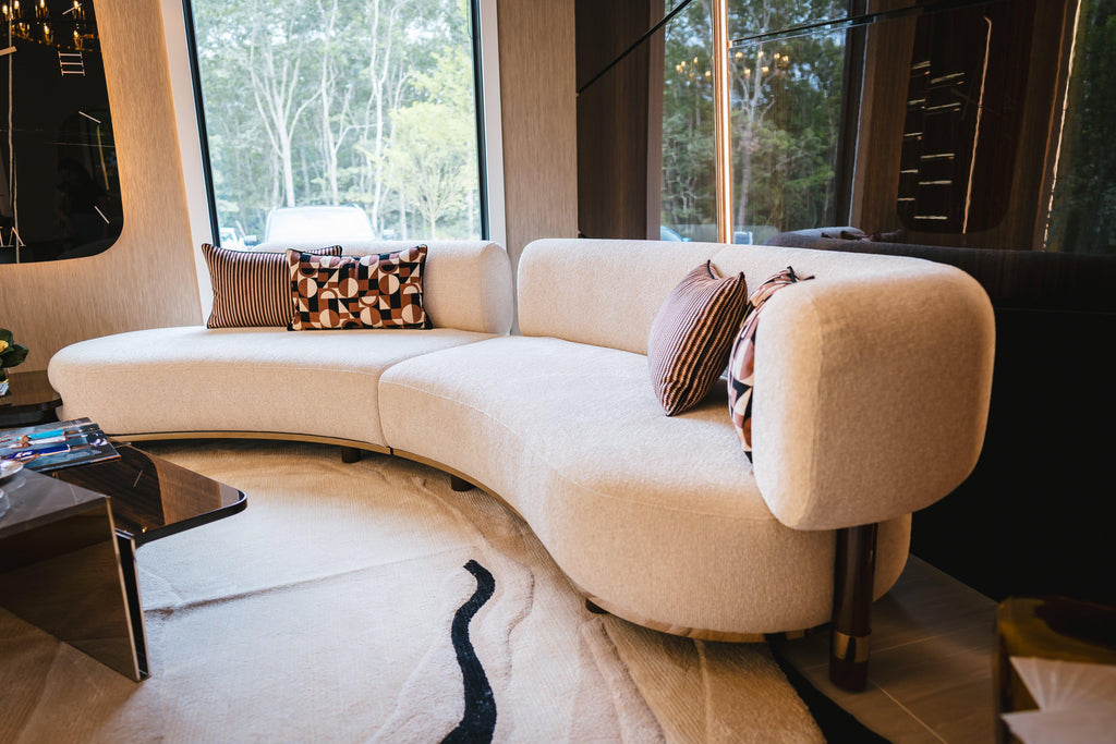https://a.1stdibscdn.com/curved-modern-blosse-sofa-in-cream-upholstery-with-integrated-walnut-side-table-for-sale-picture-8/f_104862/f_455332921755510293012/Blosse_Sofa_1_min_master.jpg