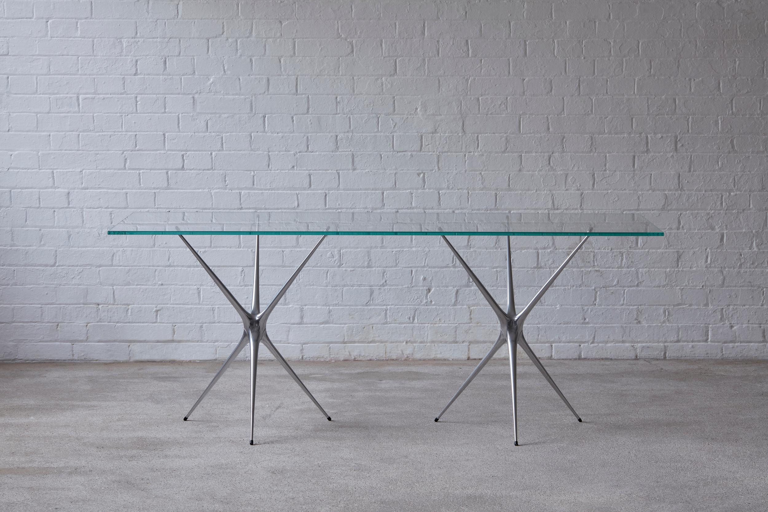 https://a.1stdibscdn.com/supernova-recycled-cast-aluminum-black-trestles-glass-desk-by-made-in-ratio-for-sale-picture-7/f_36441/f_120359631660899746556/Brodie_Neill_Supernova_Mark_Cocksedge_master.JPG