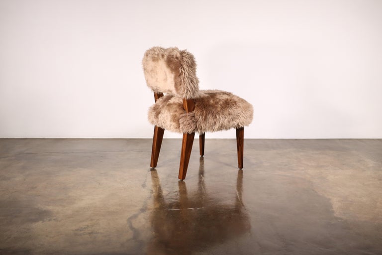 https://a.1stdibscdn.com/modern-dining-chair-in-exotic-wood-and-sheepskin-from-costantini-bruno-ovino-for-sale-picture-3/f_25173/f_323976021674588727647/Bruno_Ovino_by_Costantini_01_master.jpg?width=768