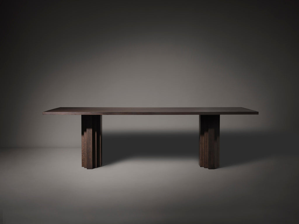https://a.1stdibscdn.com/large-mokko-dining-table-in-solid-french-oak-for-sale-picture-3/f_89302/f_429557821735654911726/Brut_Slim_Table_Dark_Brown_Front_View_photo_by_Thomas_van_Schaik_master.jpg