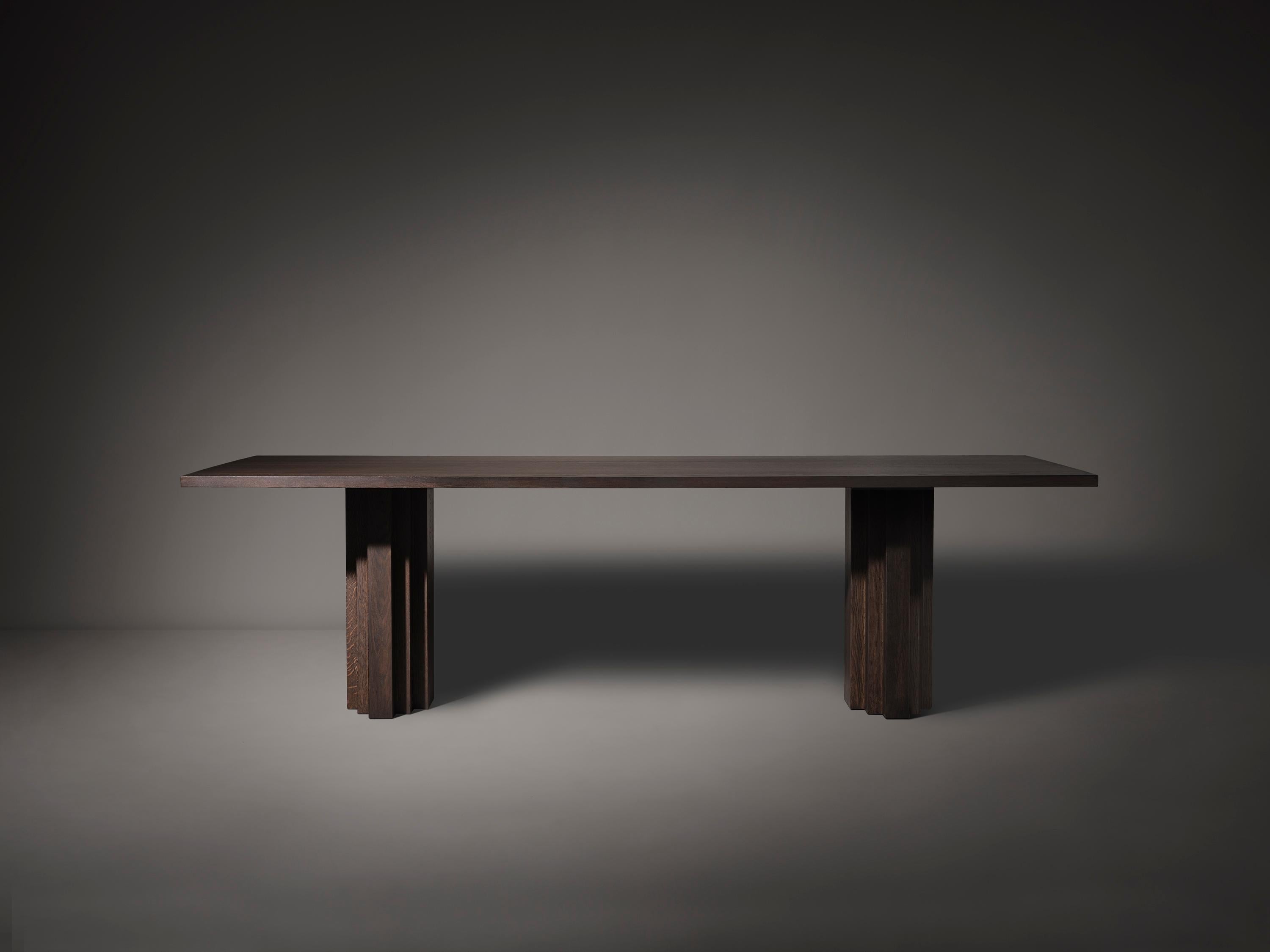 https://a.1stdibscdn.com/large-mokko-dining-table-in-solid-french-oak-for-sale-picture-3/f_89302/f_429557821735654911726/Brut_Slim_Table_Dark_Brown_Front_View_photo_by_Thomas_van_Schaik_master.jpg
