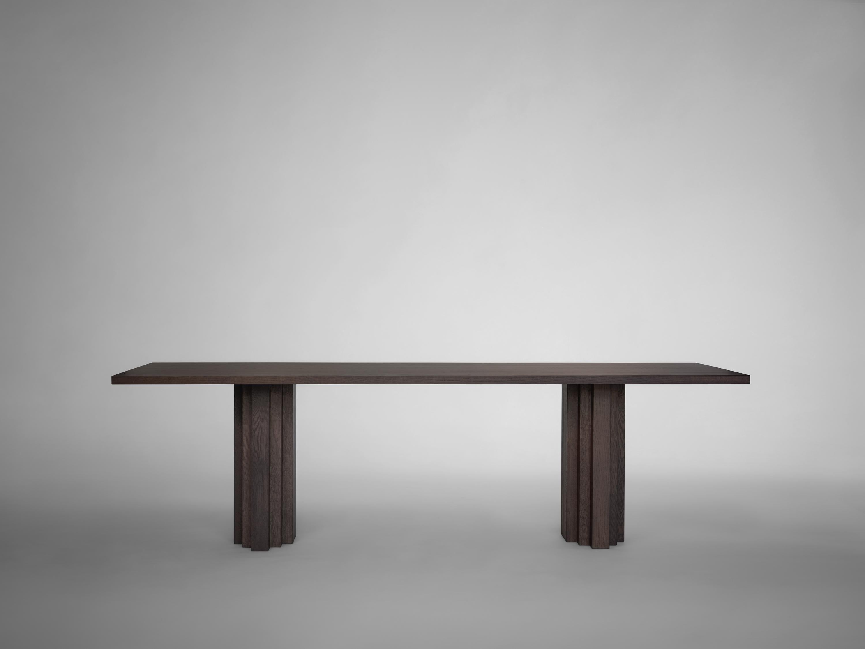 https://a.1stdibscdn.com/dining-table-sculptural-design-solid-natural-light-oak-brut-slim-by-mokko-for-sale-picture-5/f_89302/f_490451121772465541012/Brut_Slim_Table_Dark_Brown_Oak_front_view_design_by_Aad_Bos_master.jpg