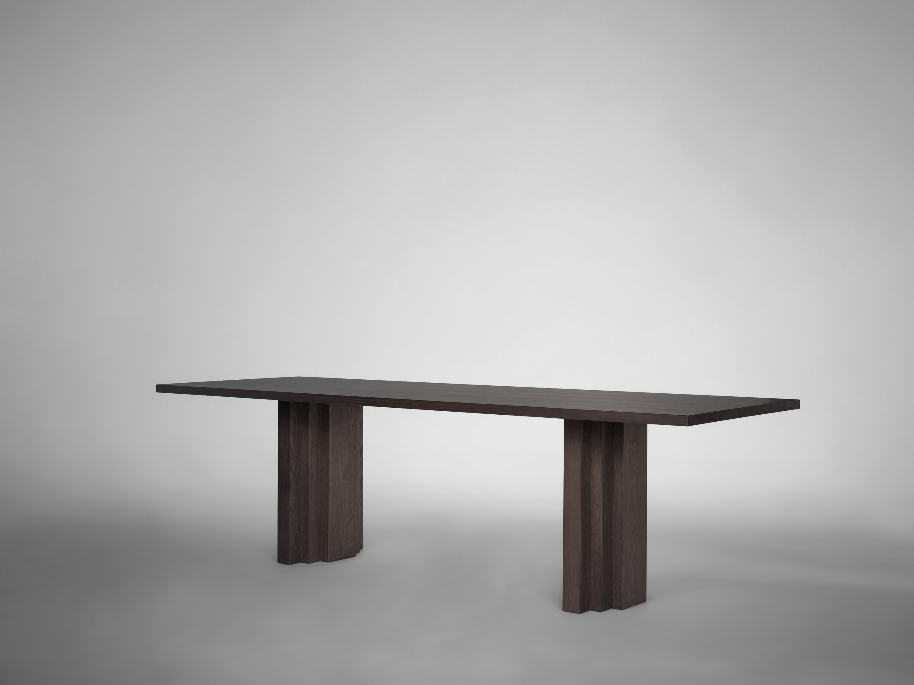 https://a.1stdibscdn.com/dining-table-sculptural-design-solid-natural-light-oak-brut-slim-by-mokko-for-sale-picture-4/f_89302/f_490451121772465540224/Brut_Slim_Table_Dark_Brown_Oak_side_view_design_by_Aad_Bos_master.jpg