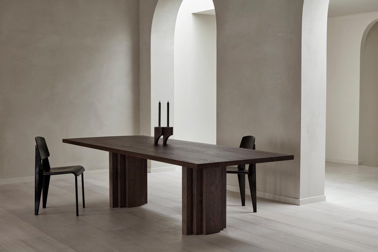https://a.1stdibscdn.com/minimalist-solid-oak-wooden-brut-slim-dining-table-for-sale-picture-10/f_89302/f_352861721726488138482/Brut_Slim_Table_and_Acer_Candle_Holder_R_2_Dark_Brown_I_Oak_setting_Achtergracht_photo_by_Thomas_van_Schaik_master.jpg?width=768