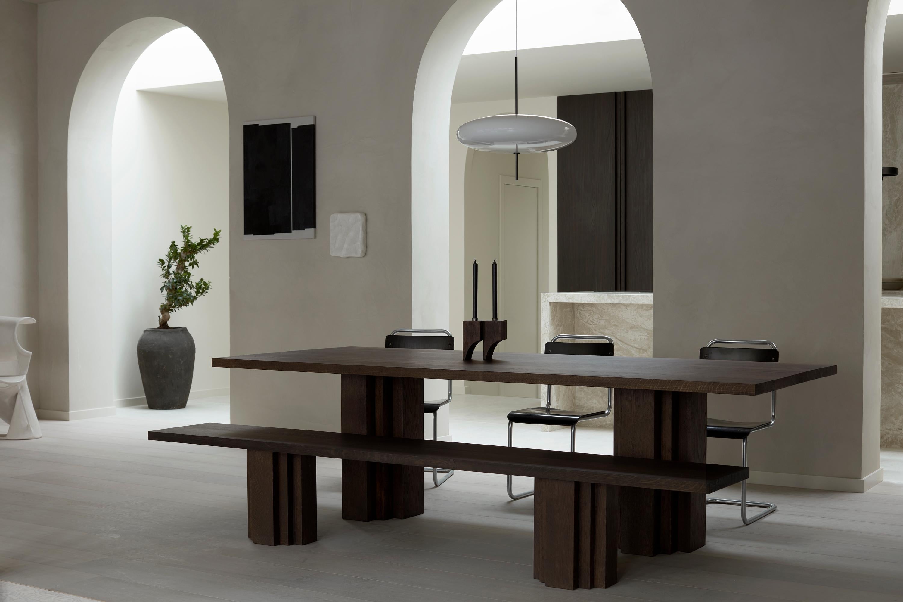 https://a.1stdibscdn.com/large-monumental-dark-brown-oak-table-brut-by-mokko-for-sale-picture-10/f_89302/f_438226221740665381984/Brut_Table_and_Bench_Dark_Brown_Oak_Full_set_styled_setting_Achtergracht_photo_by_Thomas_van_Schaik__master.jpg