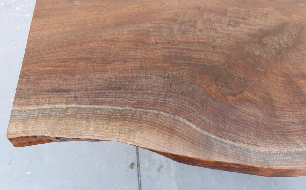 https://a.1stdibscdn.com/walnut-slab-live-edge-dining-table-custom-made-by-petersen-antiques-for-sale-picture-7/f_8065/1597847488599/C9ACD626_6E64_406E_AB4B_1FE43ABD342C_master.jpeg