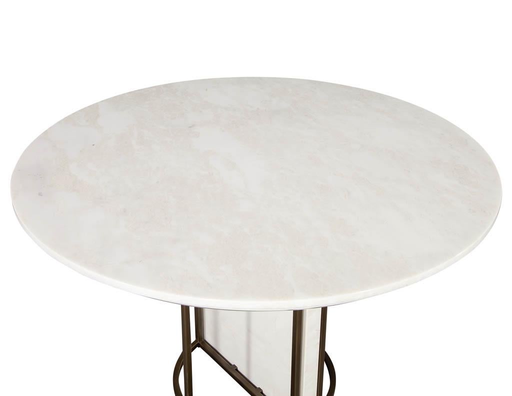 https://a.1stdibscdn.com/custom-modern-round-marble-top-dining-table-with-brass-detailing-for-sale-picture-3/f_8849/f_254206821632339504634/CE_3300_Custom_Round_Modern_Marble_Table_003_master.jpg