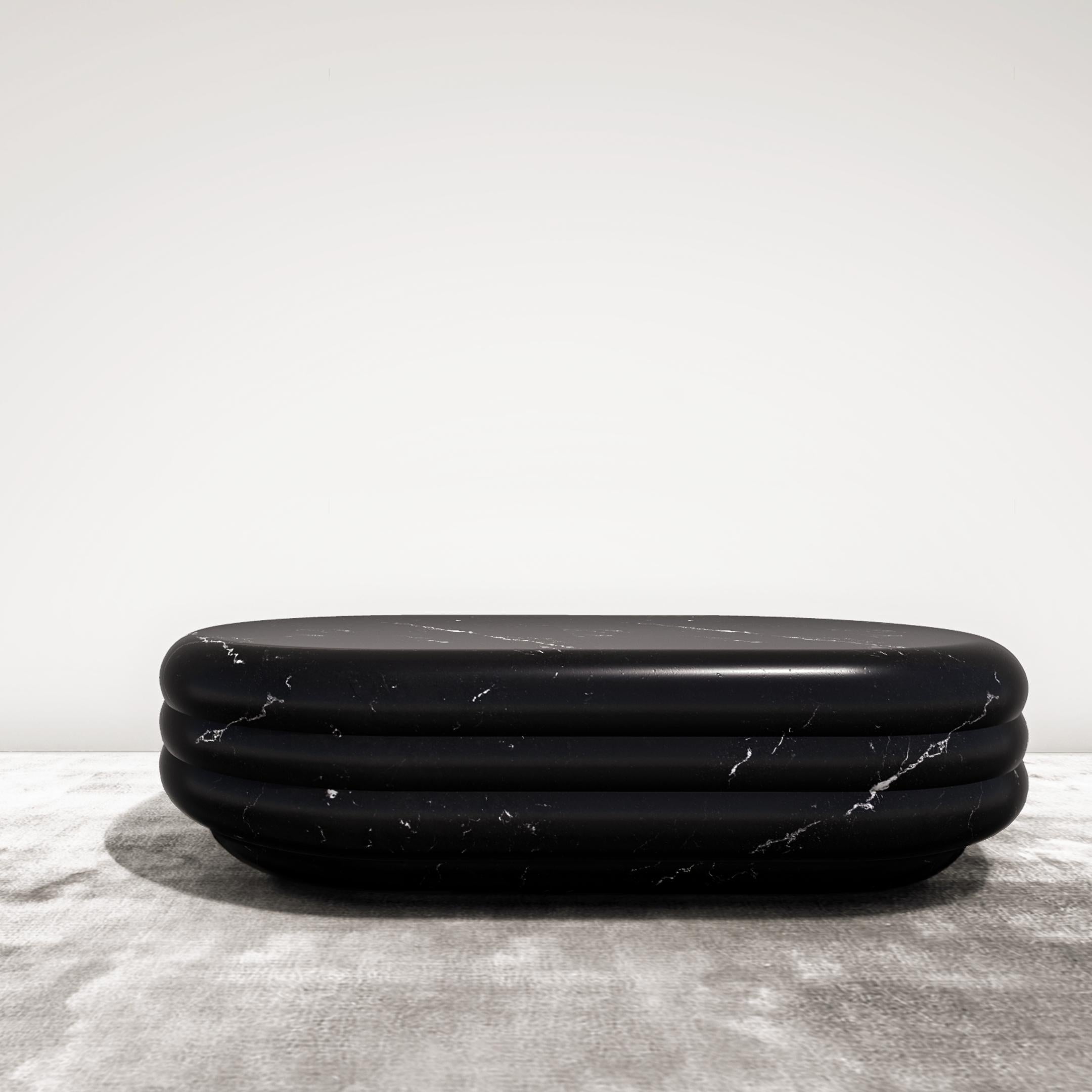 https://a.1stdibscdn.com/chloe-curvy-oval-coffee-table-in-sculpted-black-marquina-marble-for-sale-picture-2/f_22063/f_273278421644586469637/CHLOEbm_amb_master.jpg