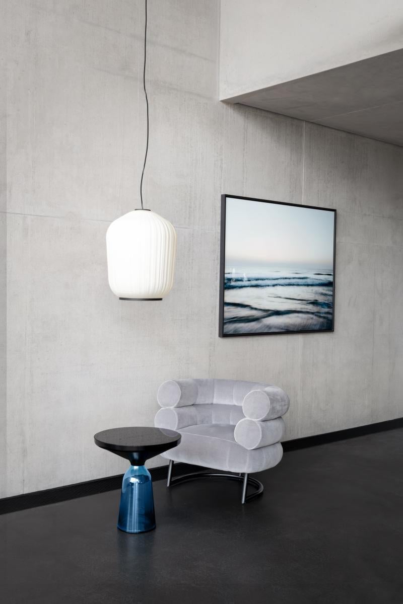 https://a.1stdibscdn.com/classicon-bell-side-table-by-sebastian-herkner-montana-blue-glass-black-for-sale-picture-3/f_105752/f_491494221773086133710/ClassiCon_bell_side_table_plissee_pendant_lamp_bibendum_armchair_photo_hassos_master.jpg